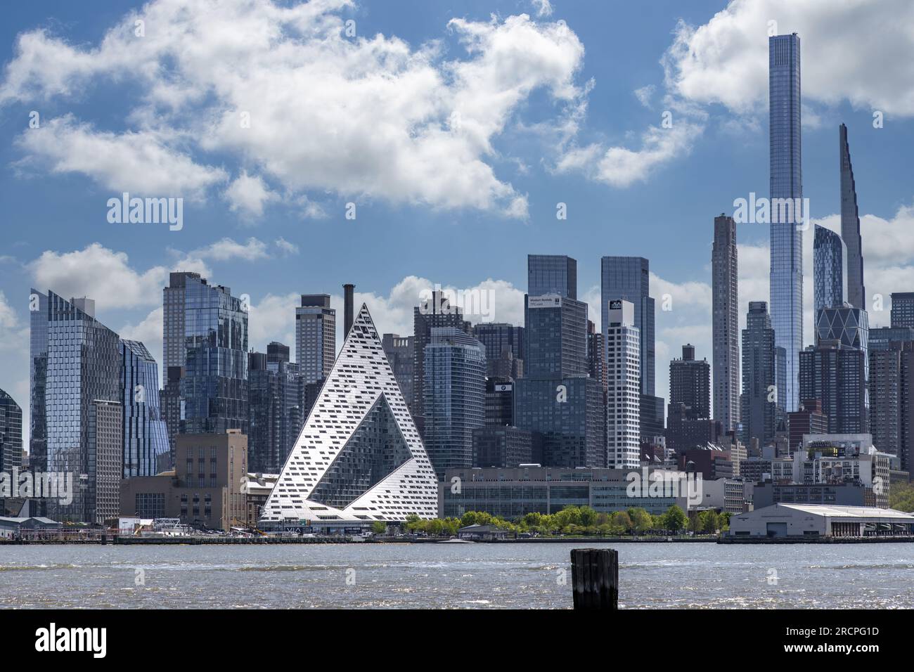 New York City, NY, USA-May 2022; Panoramic view over Hudson River towards midtown Manhattan with skyscrapers like pyramid shaped tower block or tetrah Stock Photo