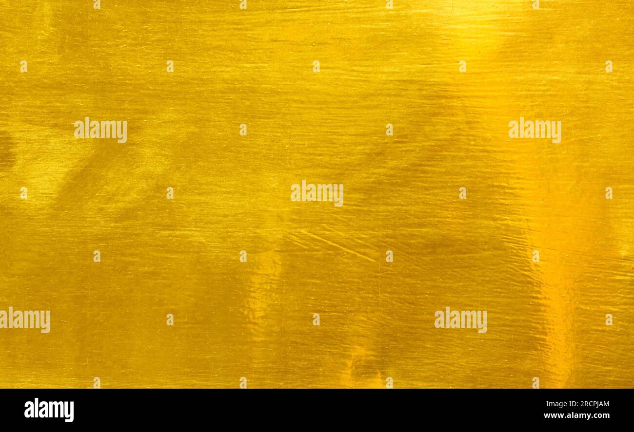 Shiny yellow leaf gold foil texture background Stock Photo