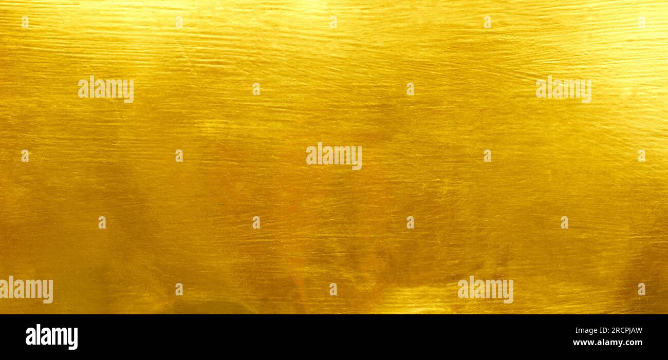 Shiny yellow leaf gold foil texture background Stock Photo
