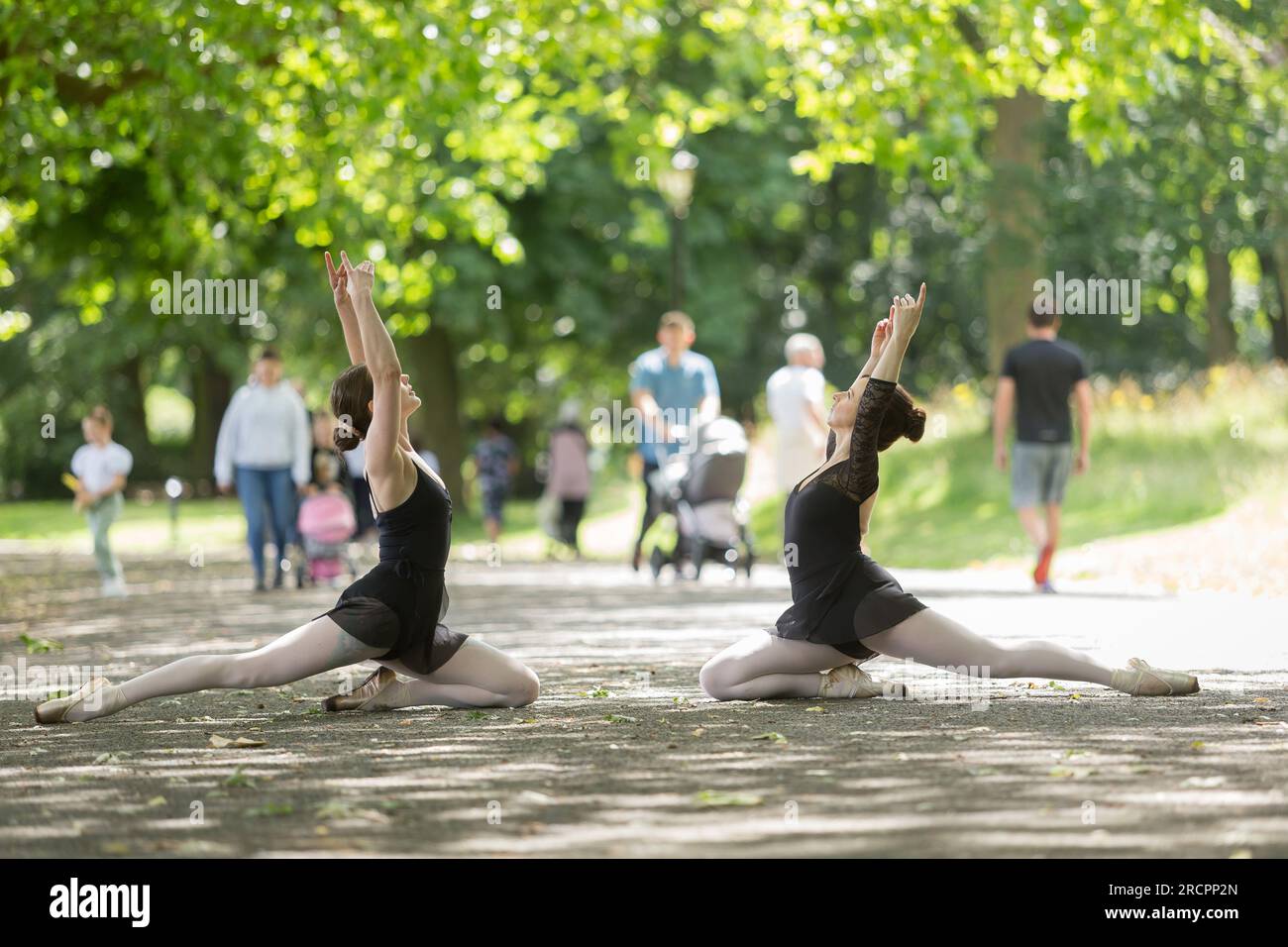 Two young women practice ballet in a public park, summer. 2023 Stock Photo