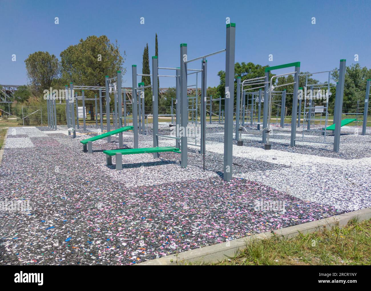 Calisthenics park floor made from recycled rubber particles. Outdoors daylight shot Stock Photo