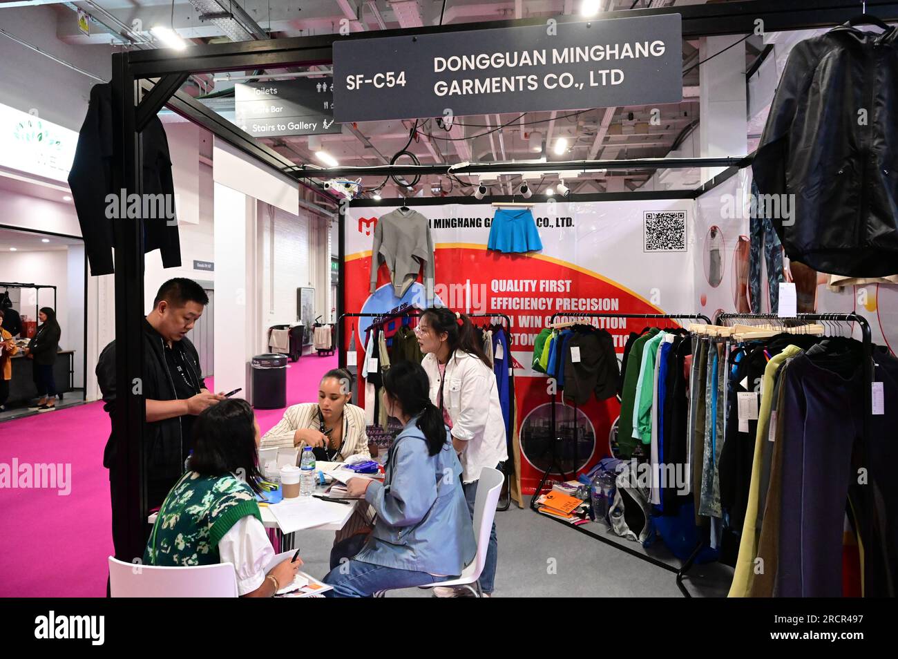 Dongguan Minghang Garments Co., Ltd., Experts in Manufacturing and Exporting Sports Wear/ Yoga Wear/ Gym Wear/ Yoga Pants/ Sports Bra and many more other - Exhibition at Source Fashion, fashion exhibition featuring China Trendy Fashion & Luxury Brands, jewelry and accessories is held at London Olympia in London, UK. - 16 July 2023. Credit: See Li/Picture Capital/Alamy Live News Stock Photo