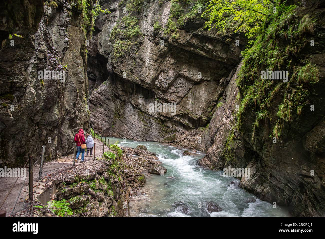 Hiking through the scenic Partnach gorge near Garmisch-Partenkirchen in ...