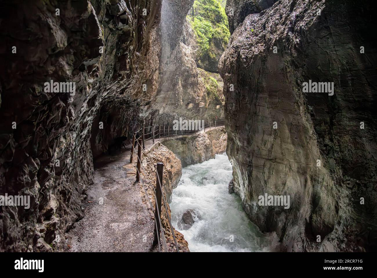 Hiking through the scenic Partnach gorge near Garmisch-Partenkirchen in ...