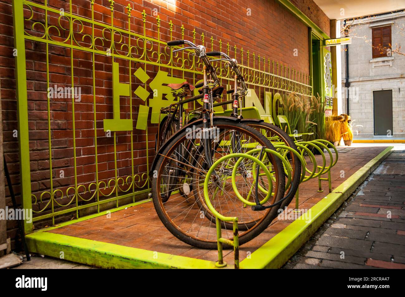 Two Yongjiu (Forever) classic bicycles at a bicycle rack outside the ...
