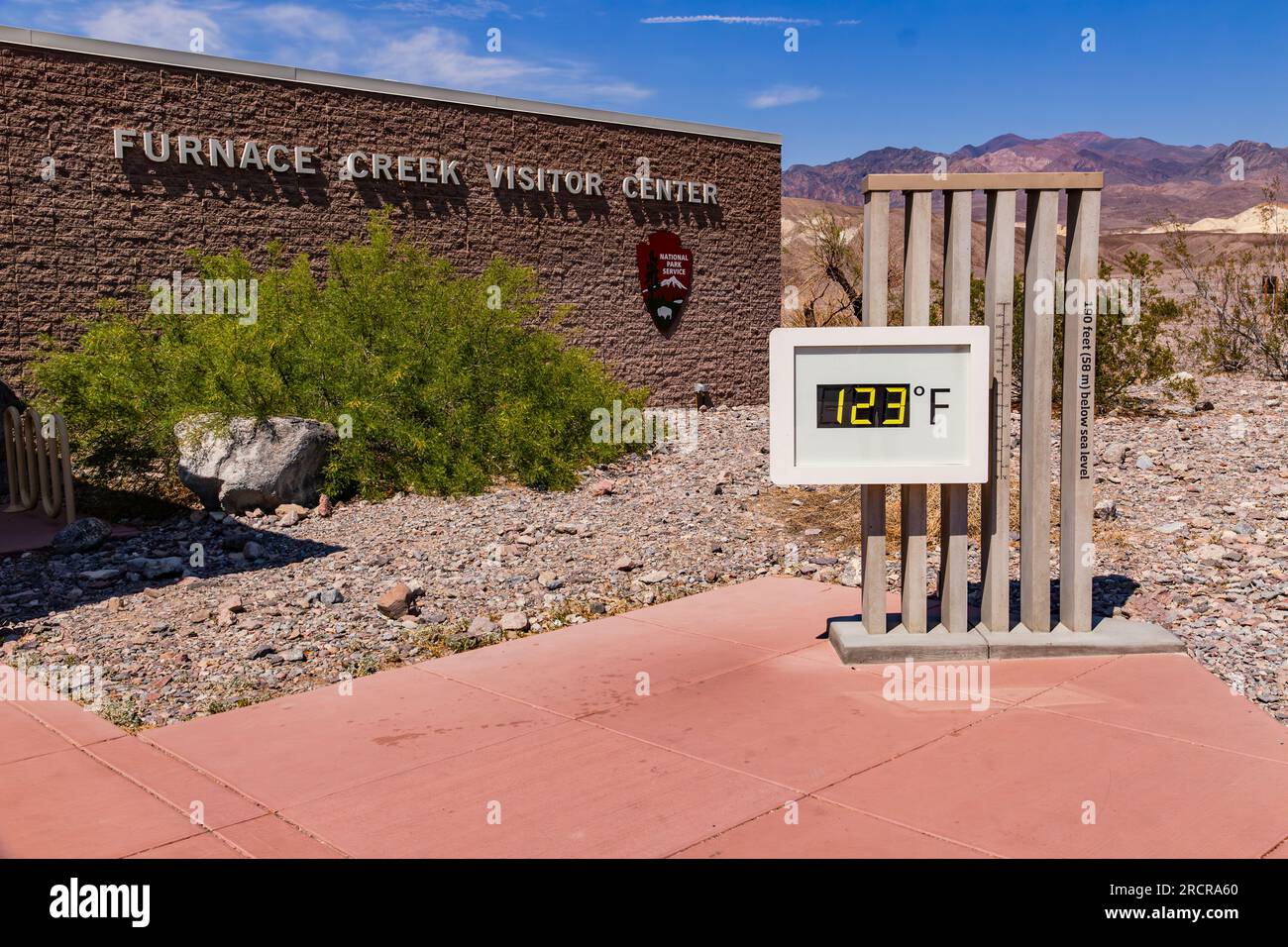 Extreme heat and heat record with 123 degrees Fahrenheit at the thermometer at Furnace Creek Visitor Center in Death Valley, United States Stock Photo