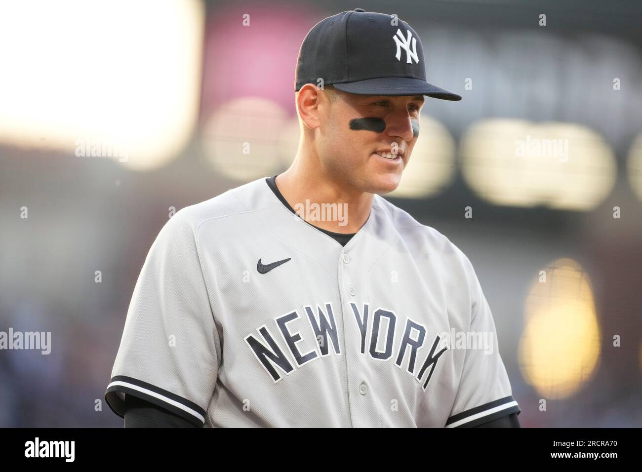 New York Yankees first baseman Anthony Rizzo looks on in an NYPD hat  against the New York Mets during the seventh inning of a baseball game on  Saturday, Sept. 11, 2021, in