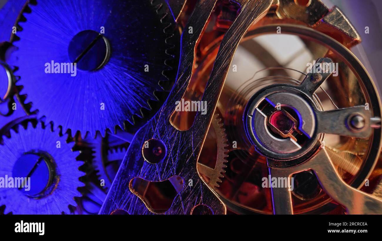 Macro mechanical vintage watch. Arrow, gears rapidly rotating. Time running fast Stock Photo Alamy