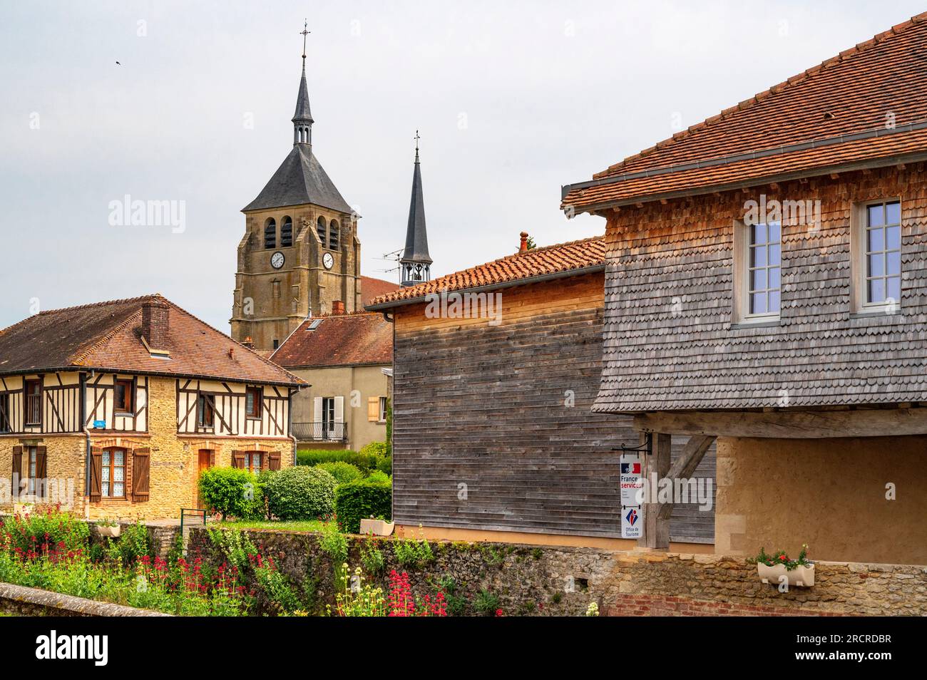 The town centre of Soulaines-Dhuys seen from the Raines river, France Stock Photo