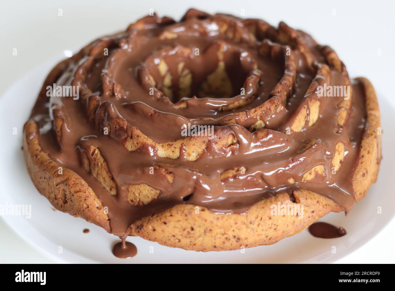 Rose flower shaped whole wheat plantain cake topped with chocolate