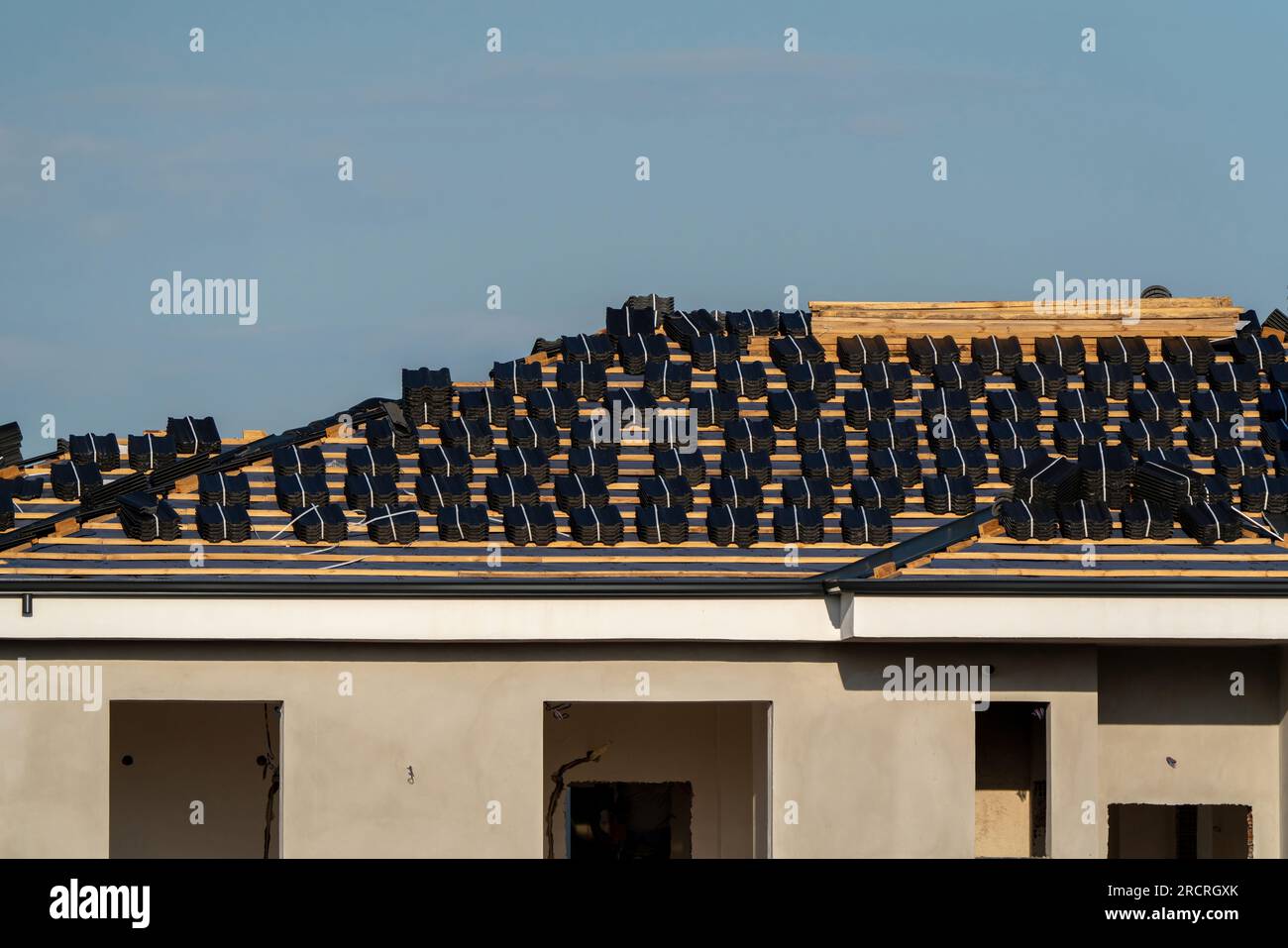 Roof tiles placed for laying on the roof in Turkey Stock Photo