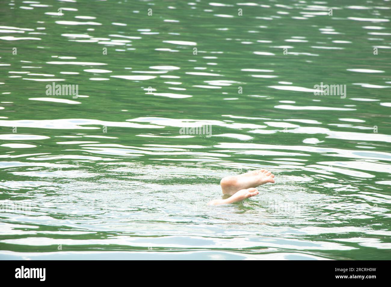 Ukraine teen naked Men's legs stick out of the water in a quarry in Ukraine during swimming,  feet in the water, drowning, summer Stock Photo - Alamy