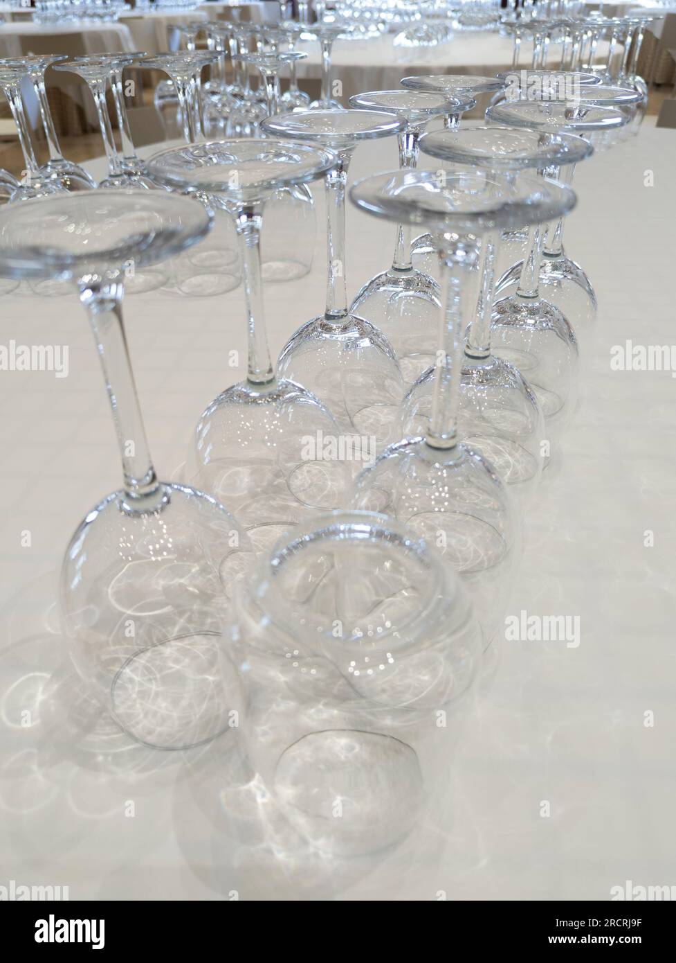 The Art of Wine Appreciation: A Captivating Scene at a Refined Restaurant Table, Showcasing an Assortment of Empty Wine Glasses, an Invitation to Deli Stock Photo