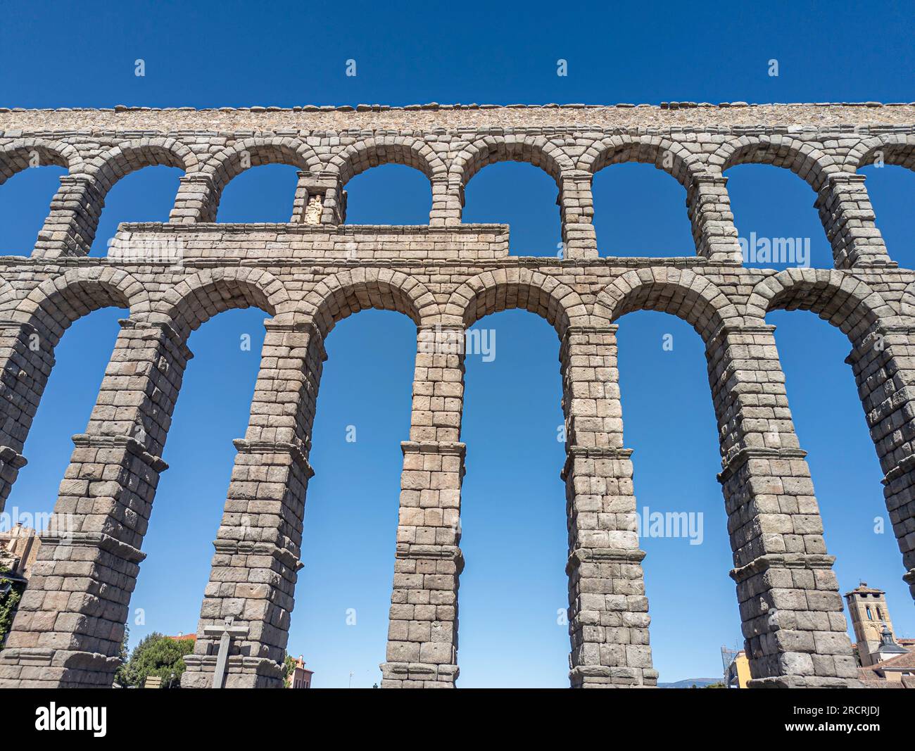 Echoes of Roman Grandeur: Majestic Segovia Aqueduct, an Impeccable Testament to the Architectural Brilliance of the Roman Empire Stock Photo