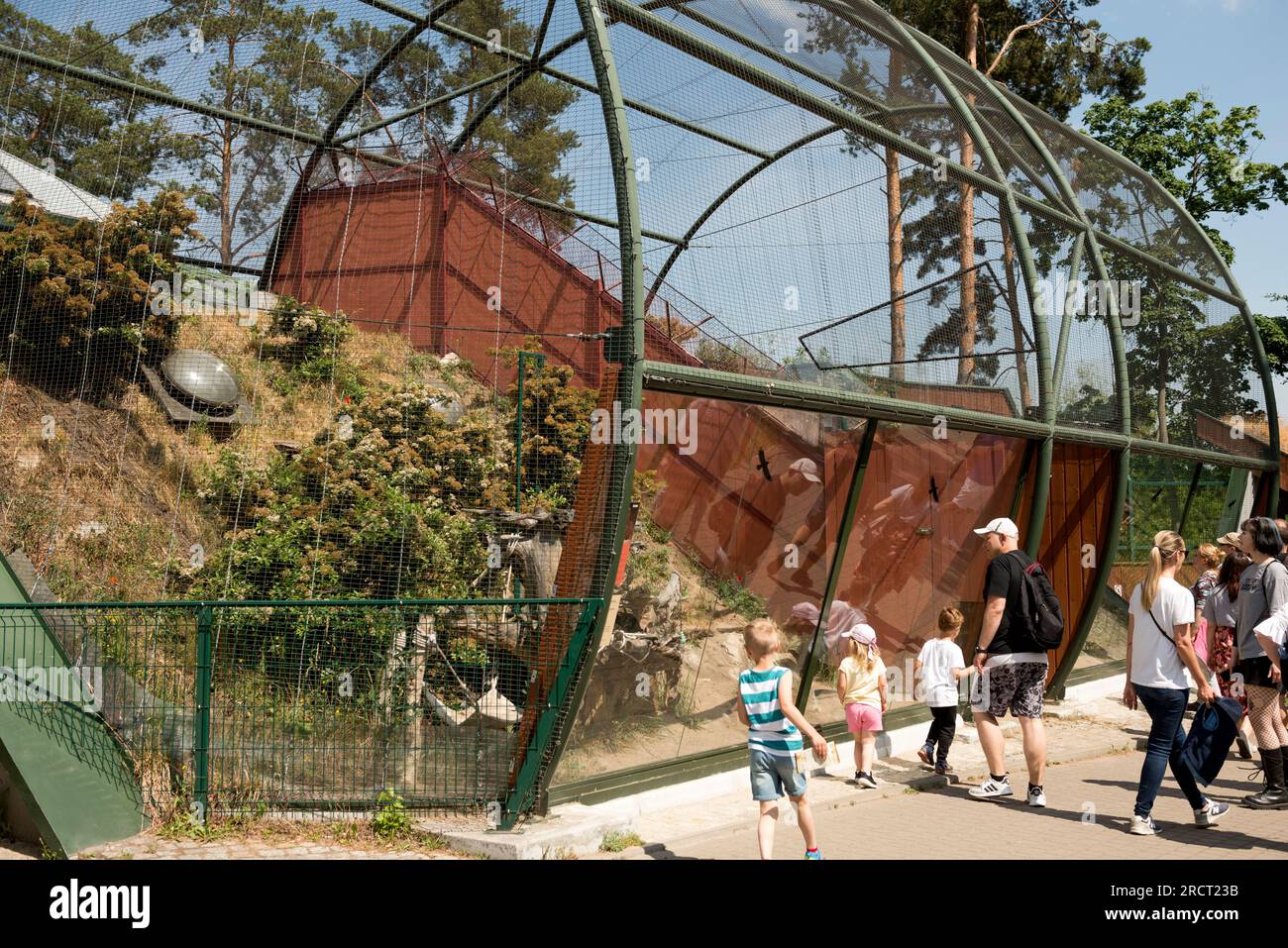 Zoo visitors at the Sand Cat enclosure large cage in the Gdansk Zoo, Oliwa, Gdansk, Poland, Europe, EU Stock Photo