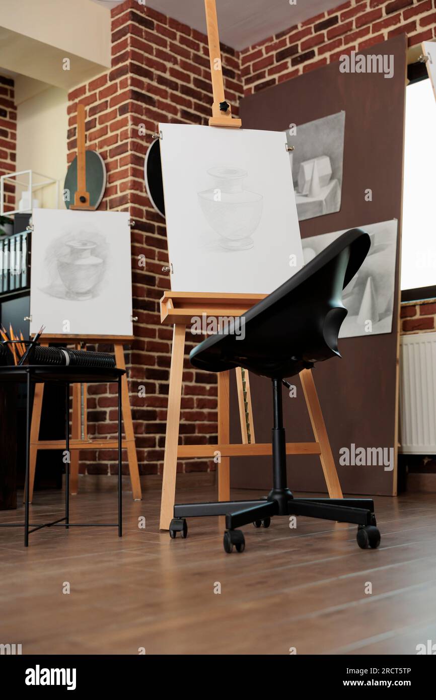 Art classroom interior with easels and drawing tools, nobody. Sketching
