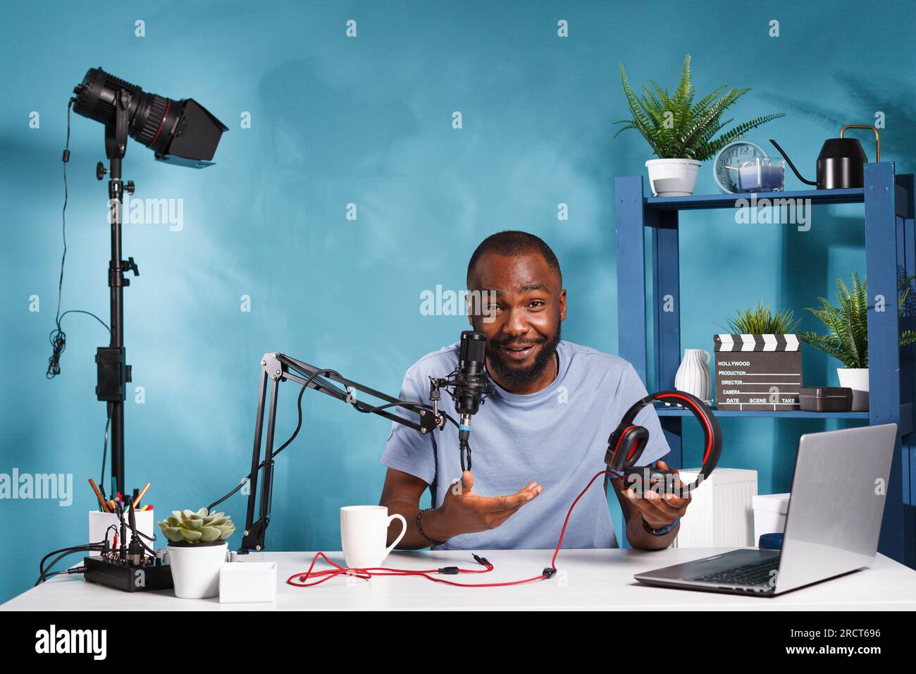 African american blogger reviewing headphones and recording video 