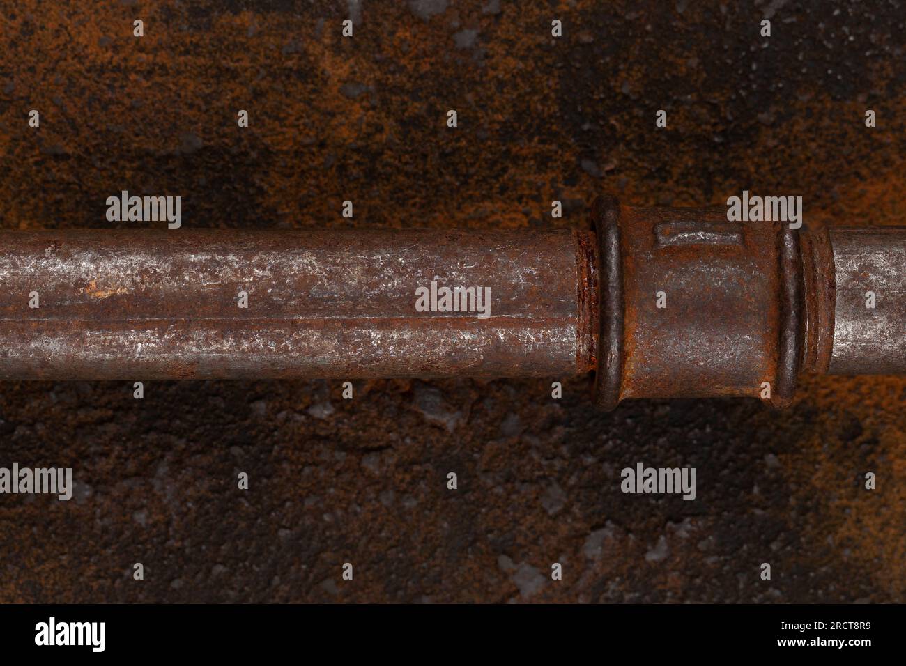 Rusty valve pipes on rusty metal wall background Stock Photo - Alamy