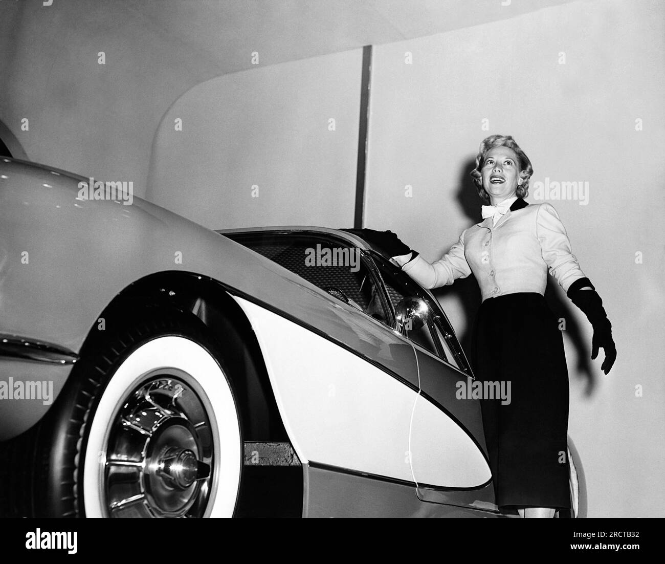 New York, New York:   January, 1956 Dinah Shore standing next to a 1956 Corvette at the General Motors Motorama Show. Chevrolet was the sponser of her TV show. Stock Photo
