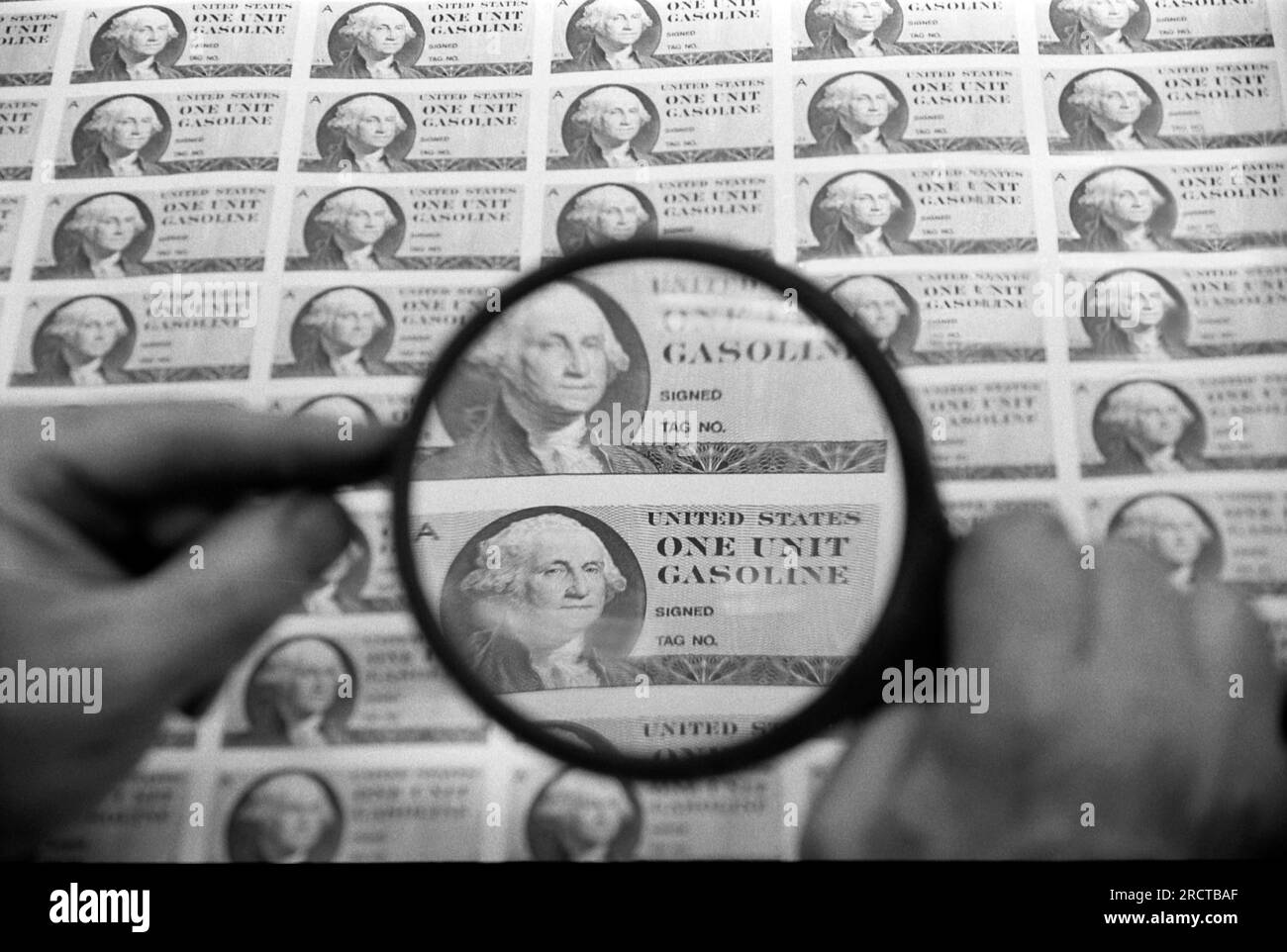 Washington, D.C.:  January 31, 1974 Gas ration stamps being printed and inspected with a magnifying glass at the Bureau of Engraving & Printing . Stock Photo