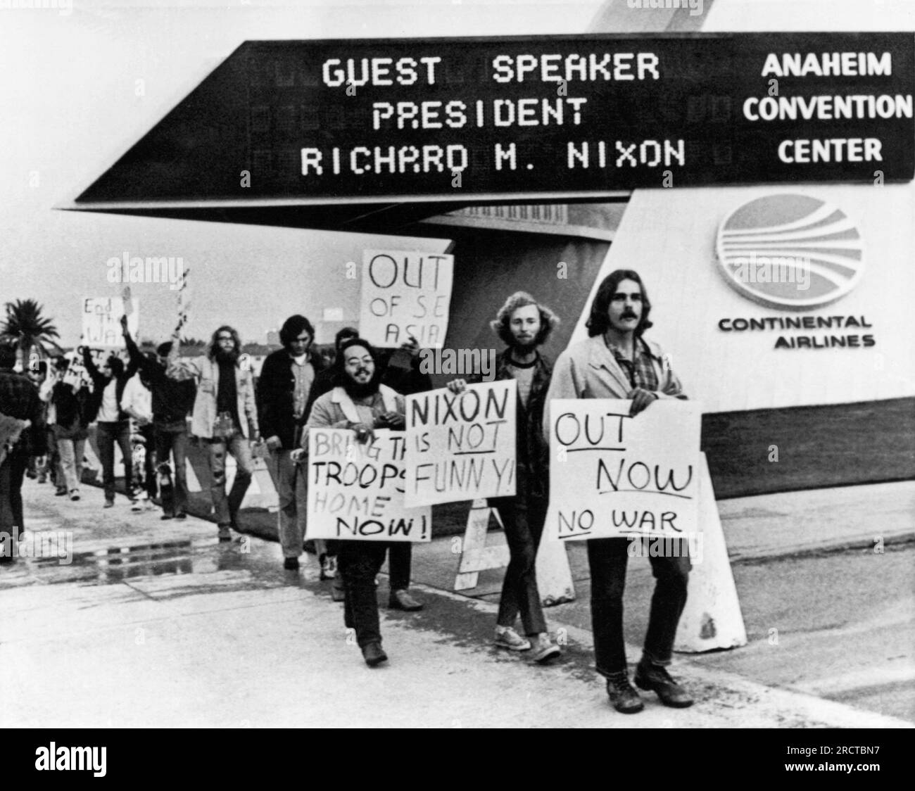 Anaheim, California:   October 30, 1970 Antiwar demonstrators march in front of the Anaheim Convention Center where Nixon is to speak. He will enter through the back door to avoid the crowds as protestors in San Jose threw rocks and eggs at him after a rally there. Stock Photo