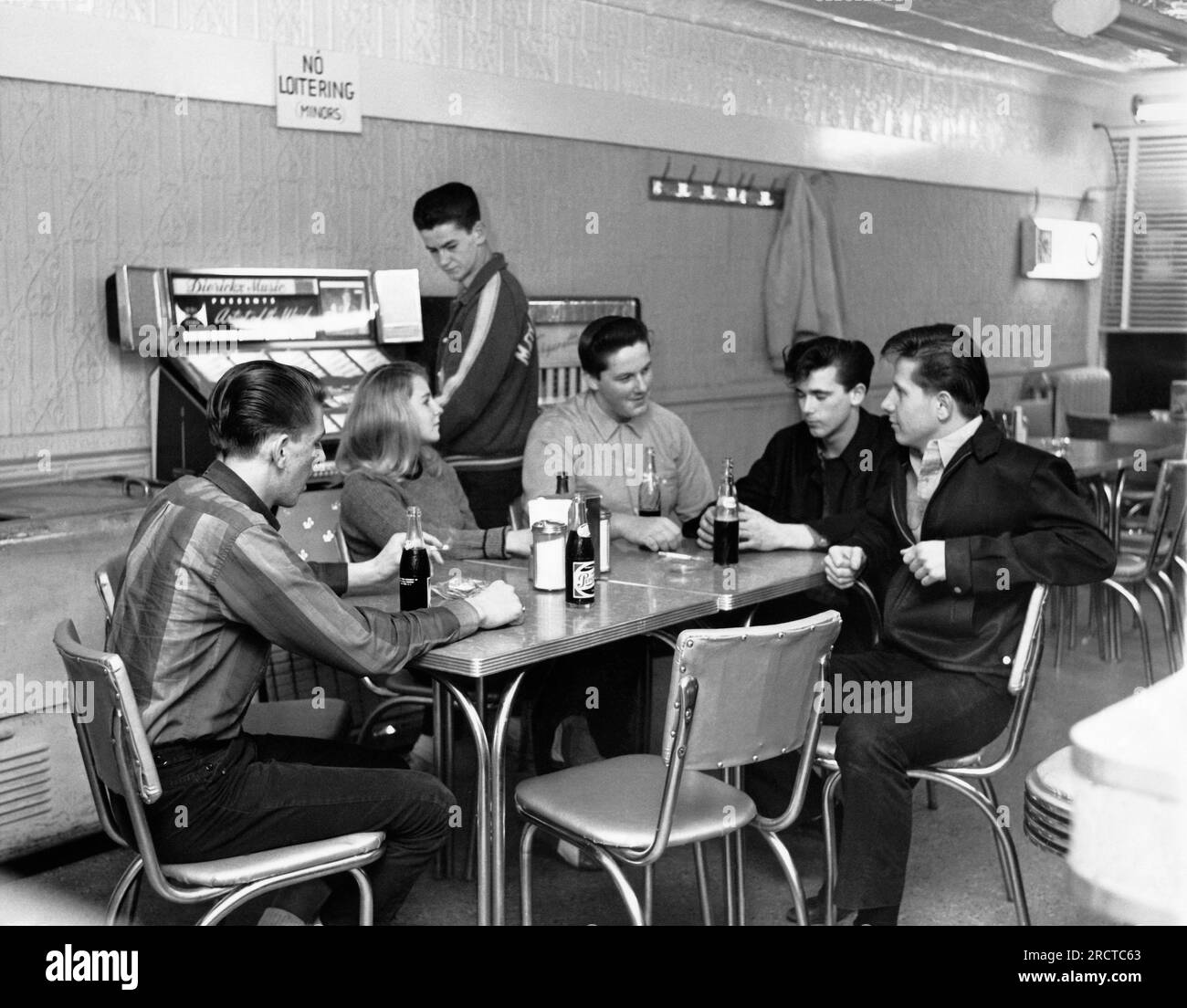 Wharton, New Jersey January 3, 1963 Teenagers hanging out at a shop