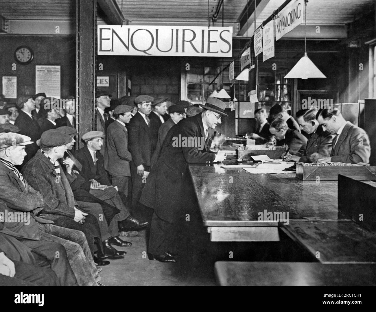 London, England: c. 1924 A scene at a London labor exchange where the