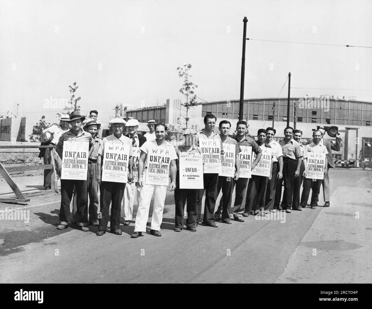 New York, New York:  July 20, 1939 Some of the WPA strikers at the North Beach Airport in Queens protesting the mandatory dismissals in the ranks of the Works Progress Administration. Stock Photo