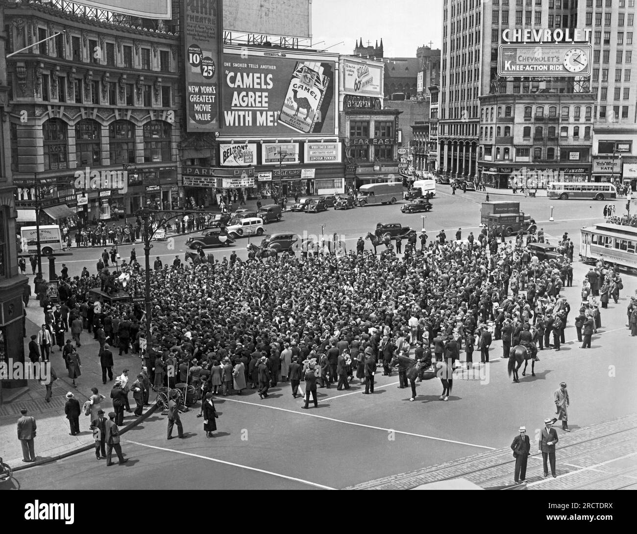 New York, New York:  May, 1938 WPA pickets gathered at Columbus Circle after marching along Columbus Avenue protesting Work Progress Administration policies. Stock Photo