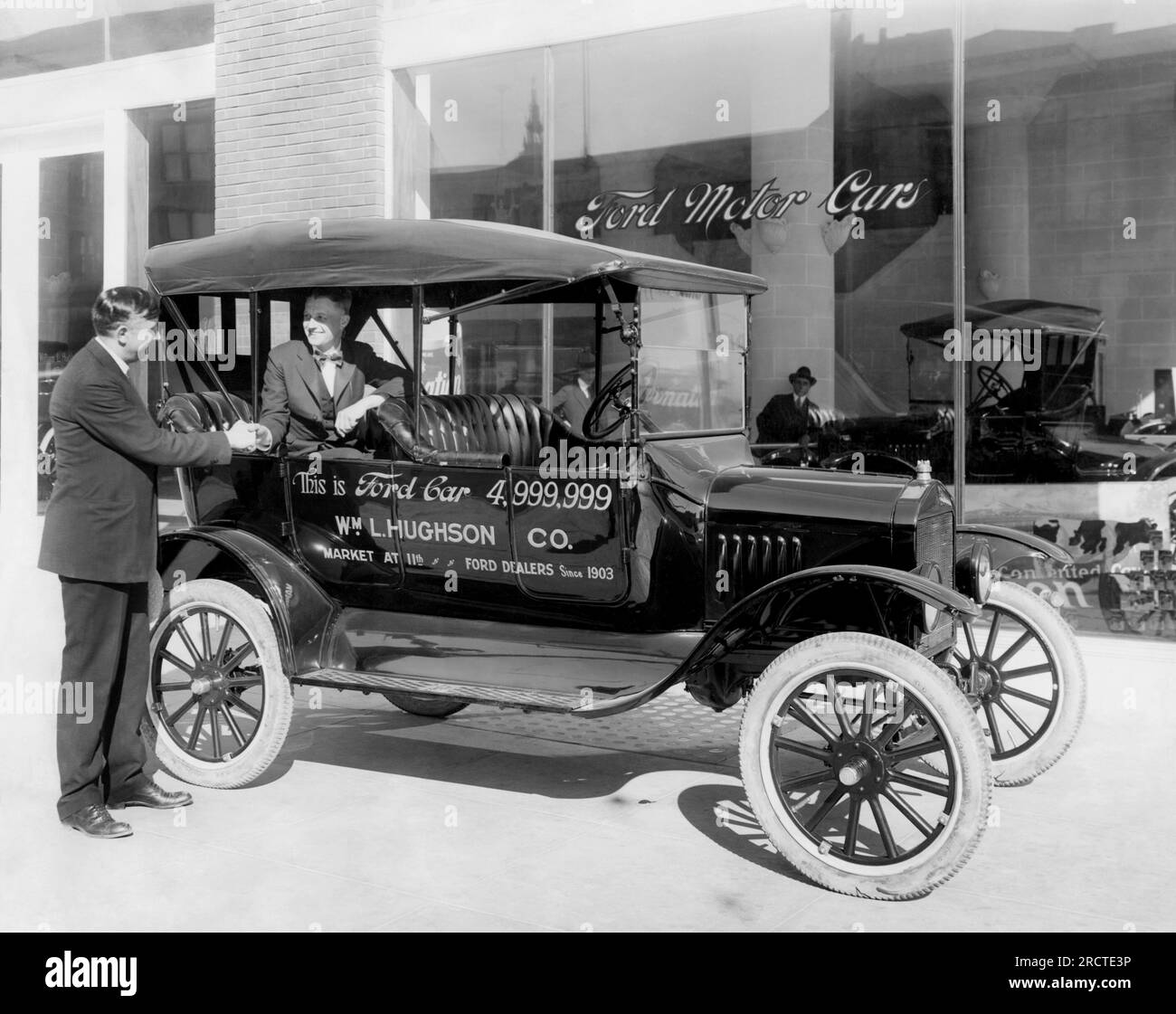 San Francisco, California::   1927 The Ford dealership on Market Street with the 4,999,999 Ford produced. Stock Photo