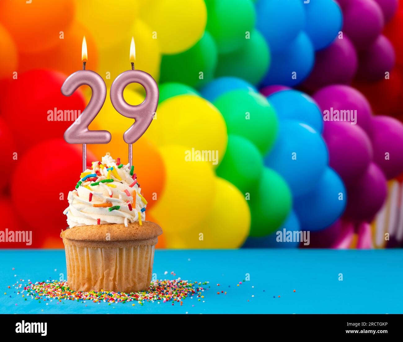 Birthday candle number 29 - Invitation card with balloons in colors of the gay pride march Stock Photo
