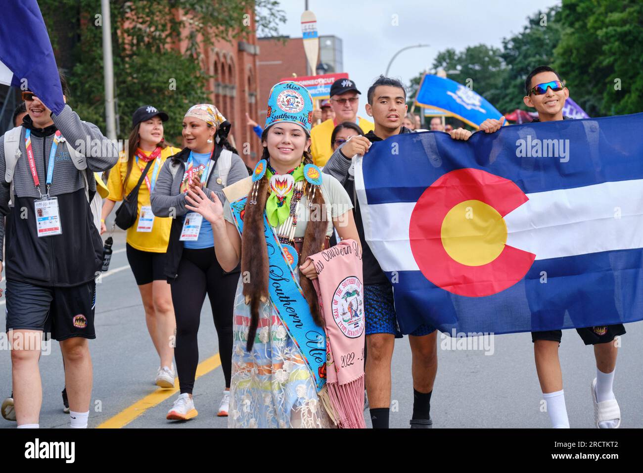 Halifax, Nova Scotia, Canada. July 16th, 2023. Miss Southern Ute Indian, part of the Colorado delegation at The athletes Parade of the opening ceremony of the 10th North American Indigenous Games (NAIG) on the streets of Kjipuktuk (Halifax). Over 5000 athletes from 756 Indigenous Nations across Turtle Island will be competing until July 23rd with competitions in 16 sports within 21 venues across the area. Credit: meanderingemu/Alamy Live News Stock Photo