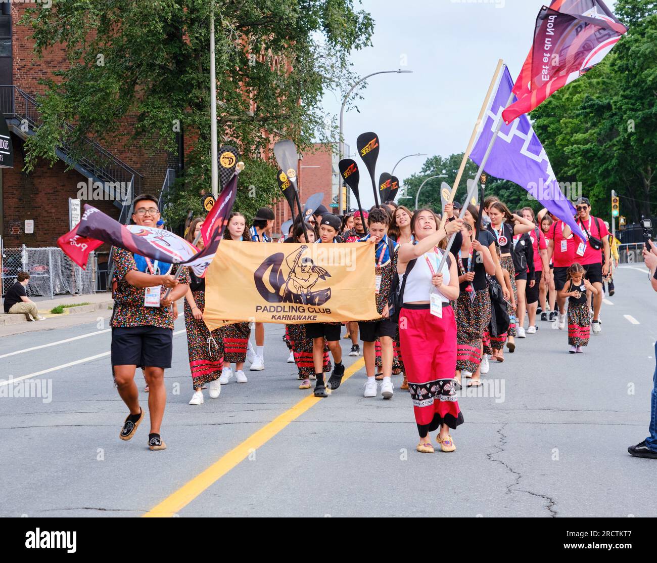 Halifax, Nova Scotia, Canada. July 16th, 2023. The Eastern Door & the North delegation of athletes part of The athletes Parade of the opening ceremony of the 10th North American Indigenous Games (NAIG) on the streets of Kjipuktuk (Halifax). Over 5000 athletes from 756 Indigenous Nations across Turtle Island will be competing until July 23rd with competitions in 16 sports within 21 venues across the area. Credit: meanderingemu/Alamy Live News Stock Photo