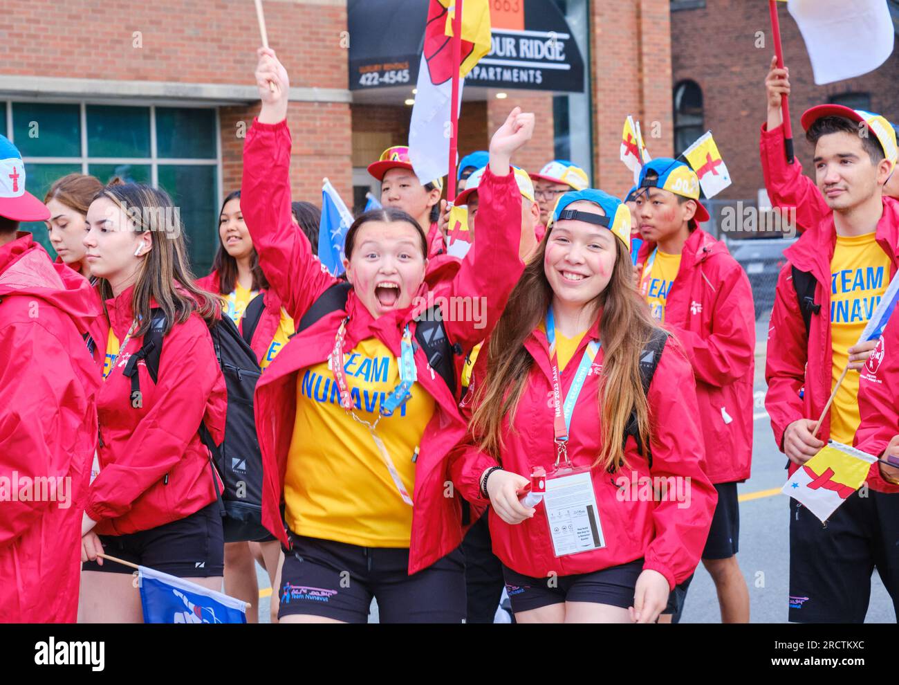 Halifax, Nova Scotia, Canada. July 16th, 2023. Athletes from the Team Nunavut delegation having fun during The athletes Parade of the opening ceremony of the 10th North American Indigenous Games (NAIG) on the streets of Kjipuktuk (Halifax). Over 5000 athletes from 756 Indigenous Nations across Turtle Island will be competing until July 23rd with competitions in 16 sports within 21 venues across the area. Credit: meanderingemu/Alamy Live News Stock Photo