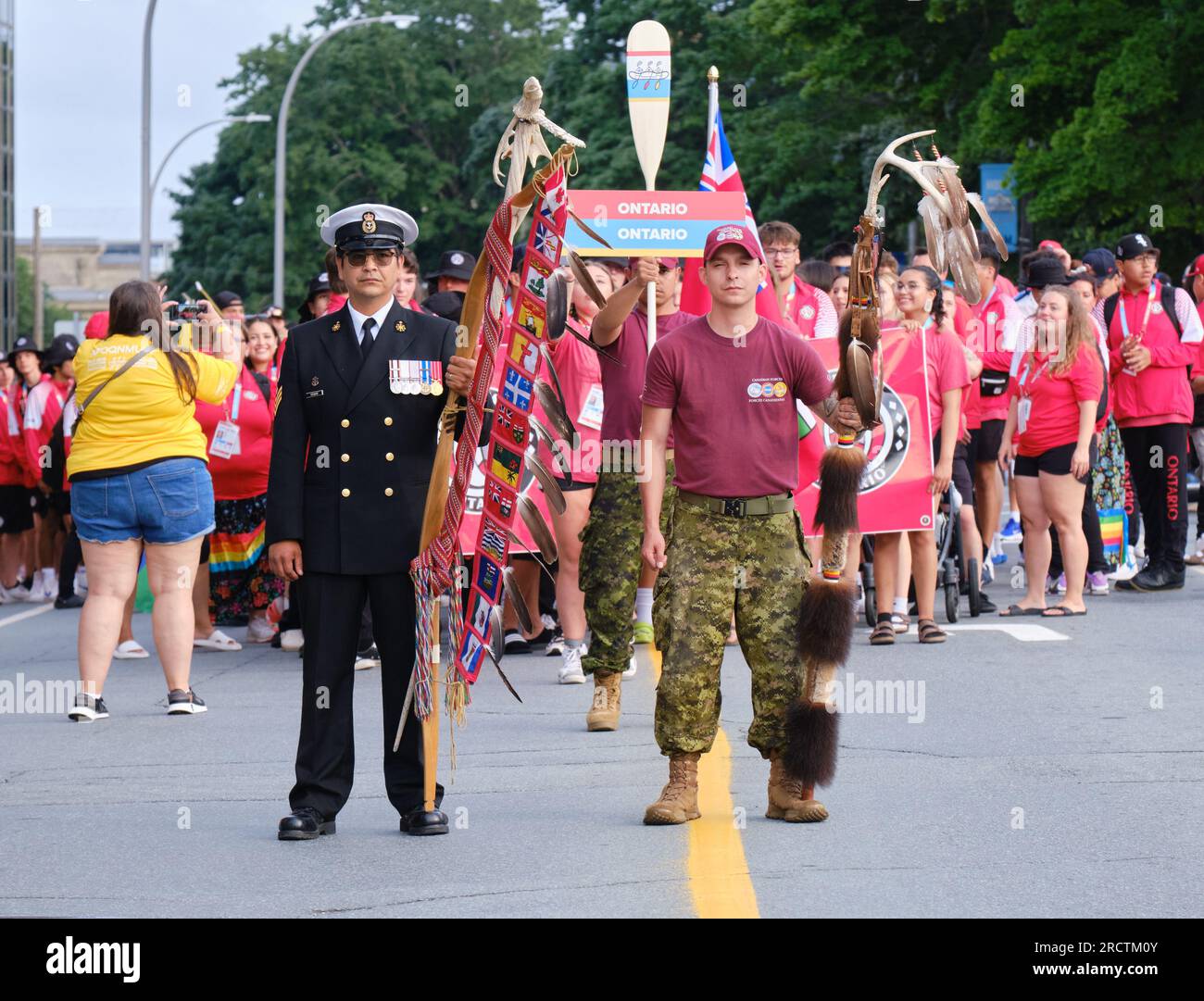 Halifax, Nova Scotia, Canada. July 16th, 2023. The lead of the athletes Parade of the opening ceremony of the 10th North American Indigenous Games (NAIG) on the streets of Kjipuktuk (Halifax), followed by the delegation from Ontario. Over 5000 athletes from 756 Indigenous Nations across Turtle Island will be competing until July 23rd with competitions in 16 sports within 21 venues across the area. Credit: meanderingemu/Alamy Live News Stock Photo
