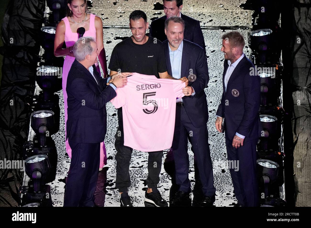 Sergio Busquets is introduced during a celebration by the team at DRV