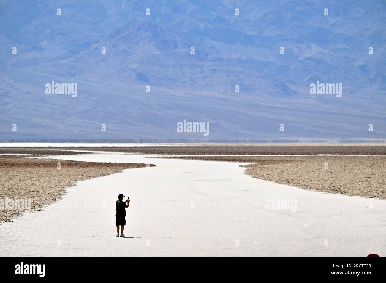 https://c8.alamy.com/comp/2RCTT2R/july-16-2023-death-valley-national-park-california-us-a-man-walks-on-the-salt-flats-at-badwater-basin-in-death-valley-national-park-california-on-july-16-2023-an-excessive-heat-warning-was-issued-for-much-of-the-southwest-united-states-climate-models-almost-unanimously-predict-that-heat-waves-will-become-more-intense-and-frequent-as-the-planet-continues-to-warm-credit-image-david-beckerzuma-press-wire-editorial-usage-only!-not-for-commercial-usage!-2RCTT2R.jpg