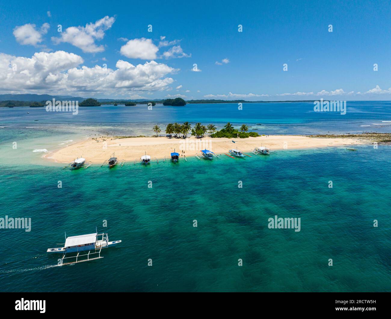 Beautiful aerial shot of group of boats in Hagonoy Island Beach. Surigao del Sur, Philippines. Mindanao. Stock Photo