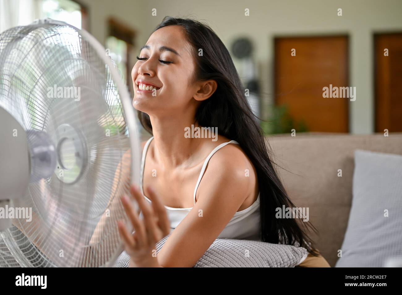 Woman cooling down fan hi-res stock photography and images - Alamy