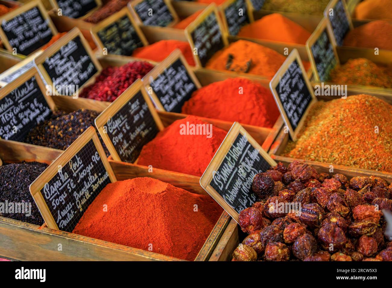 Bulk spices, paprika, chili habanero peppers and curry at a local provencal farmers market hall in the old town or Vieil Antibes, South of France Stock Photo