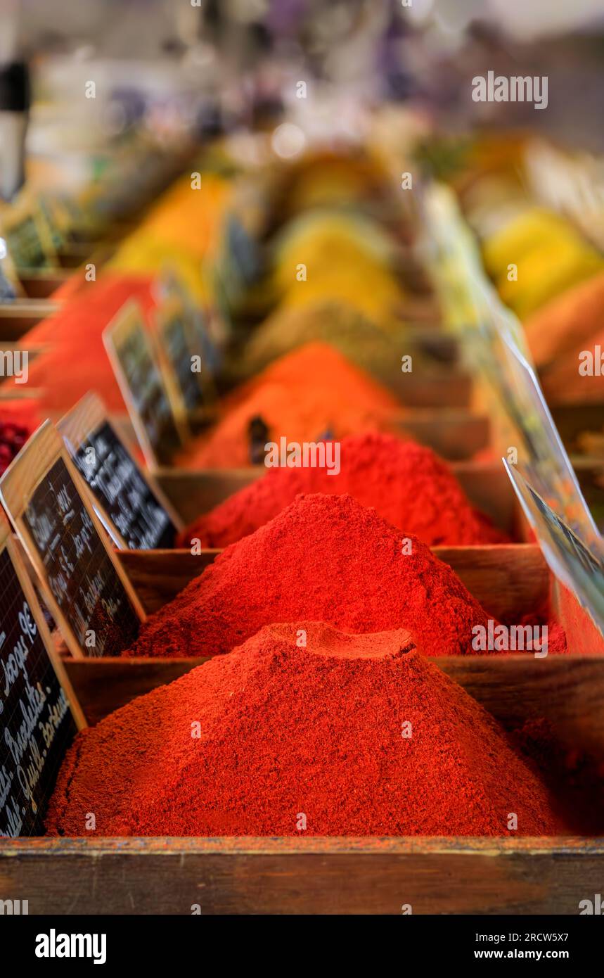 Bulk spices, curry, saffron, garam masala and paprika at a local provencal farmers market hall in the old town or Vieil Antibes, South of France Stock Photo