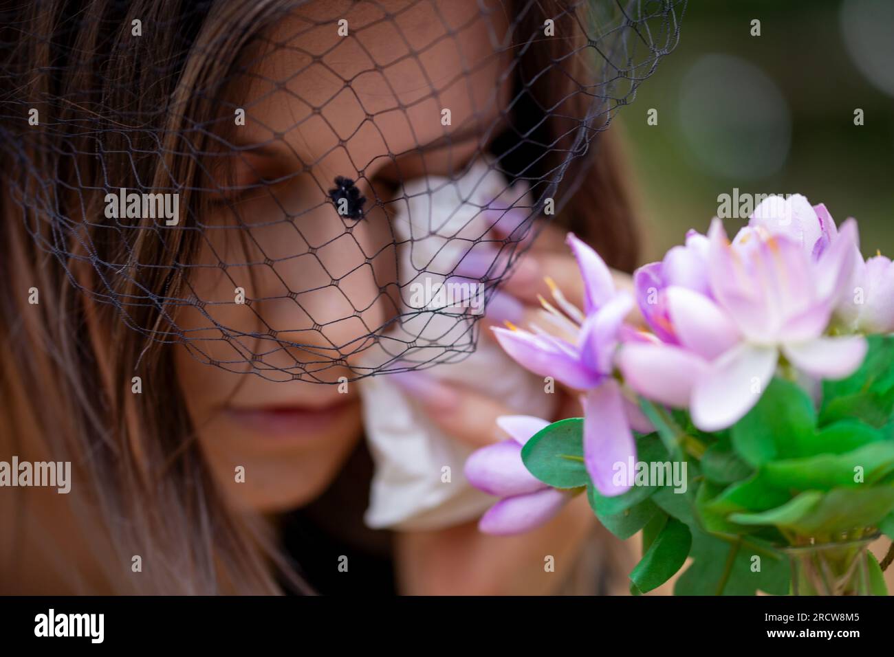 Close-up of a grieving young woman wearing a mourning veil (symbol image, model released) Stock Photo