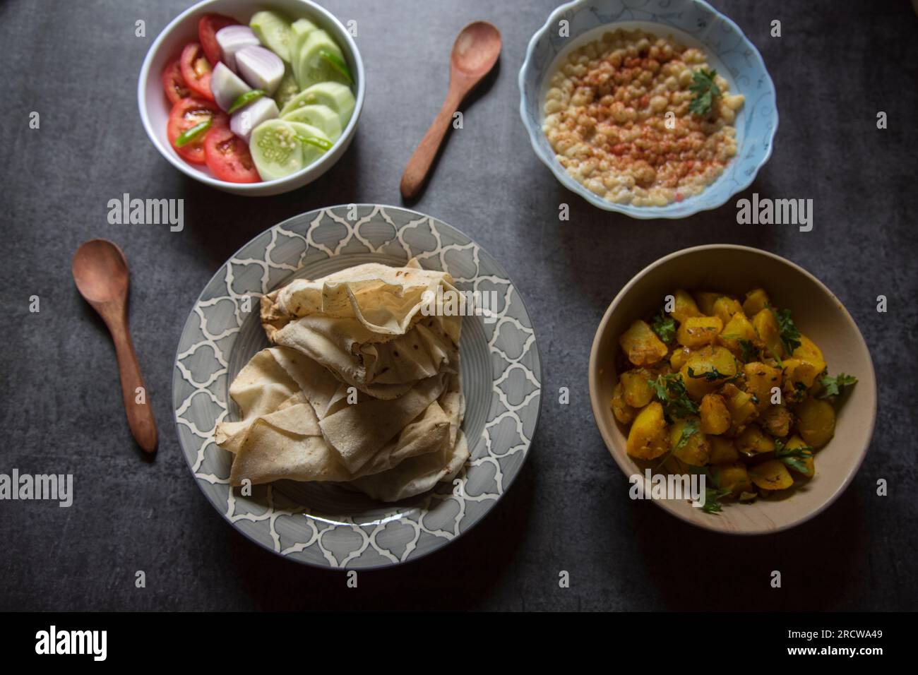 Popular Indian veg lunch rumali roti or Indian bread and alu jeera or
