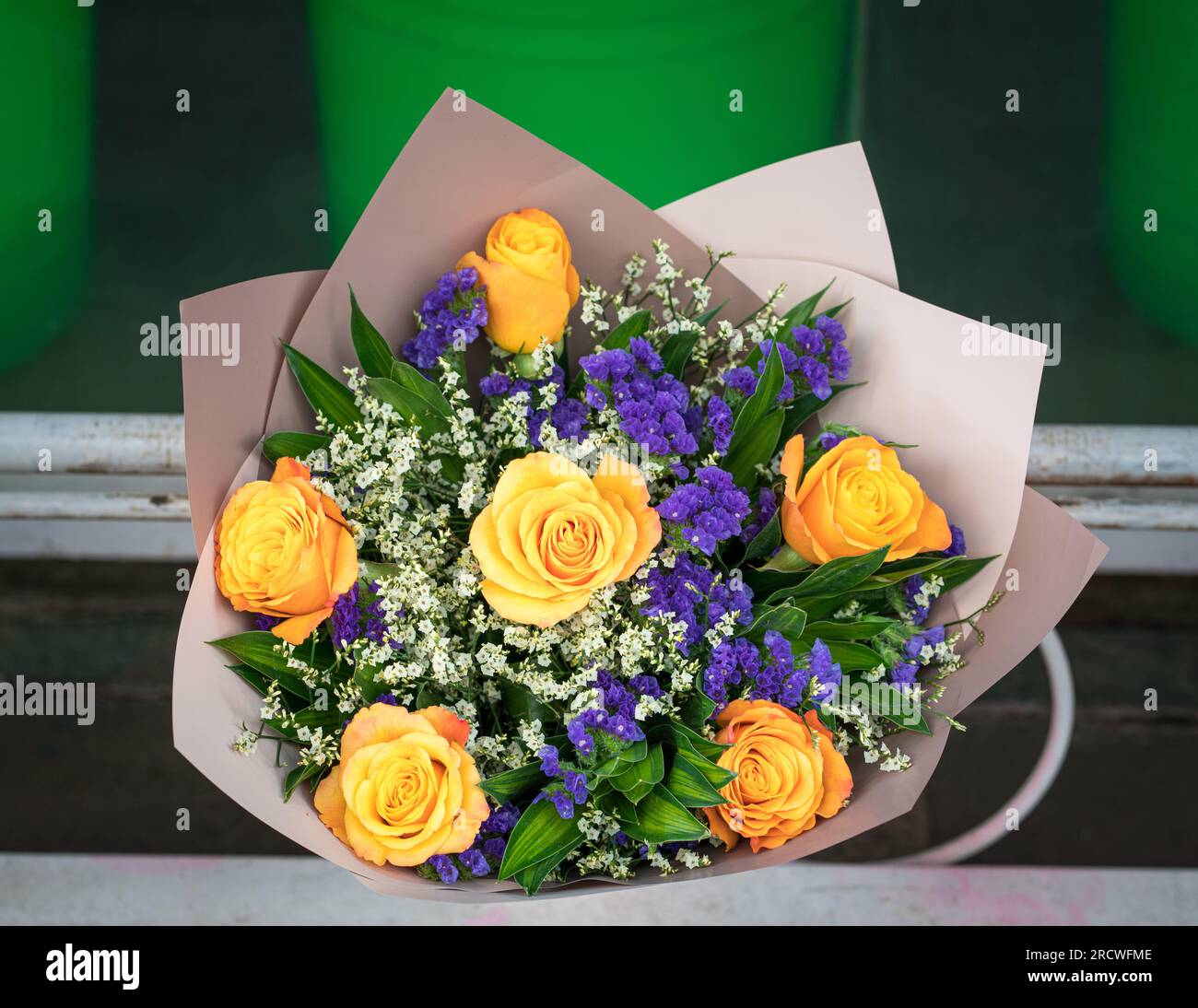 Bouquet of yellow roses with forget me not in a florist shop. Stock Photo