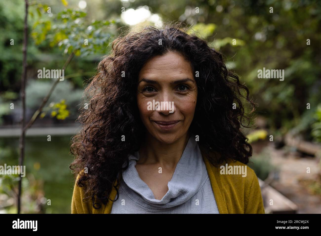 Dark curly hair hi-res stock photography and images - Alamy