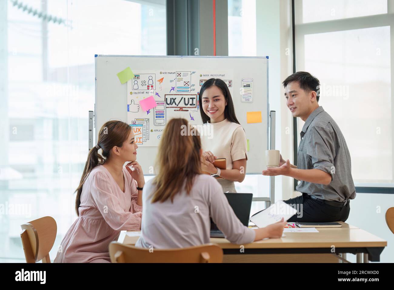 Young Developer Young developer and ui designer brainstorming interface wireframe ...