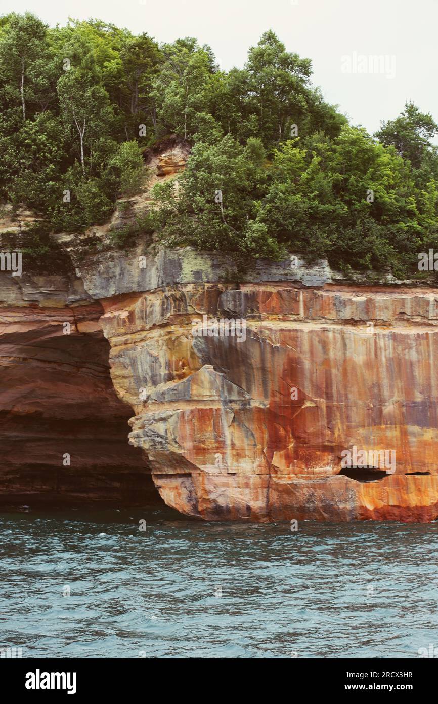 Dramatic cliffs and sea cave at Pictured Rocks National Lakeshore Stock ...