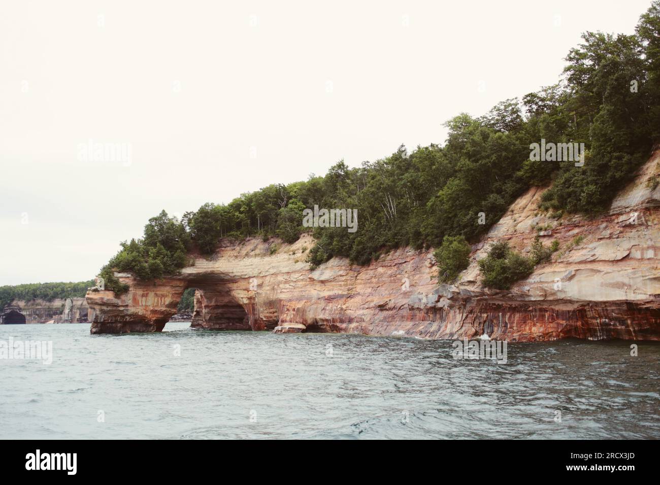 Dramatic coastal cliffs and caves at Pictured Rocks National Lakeshore Stock Photo