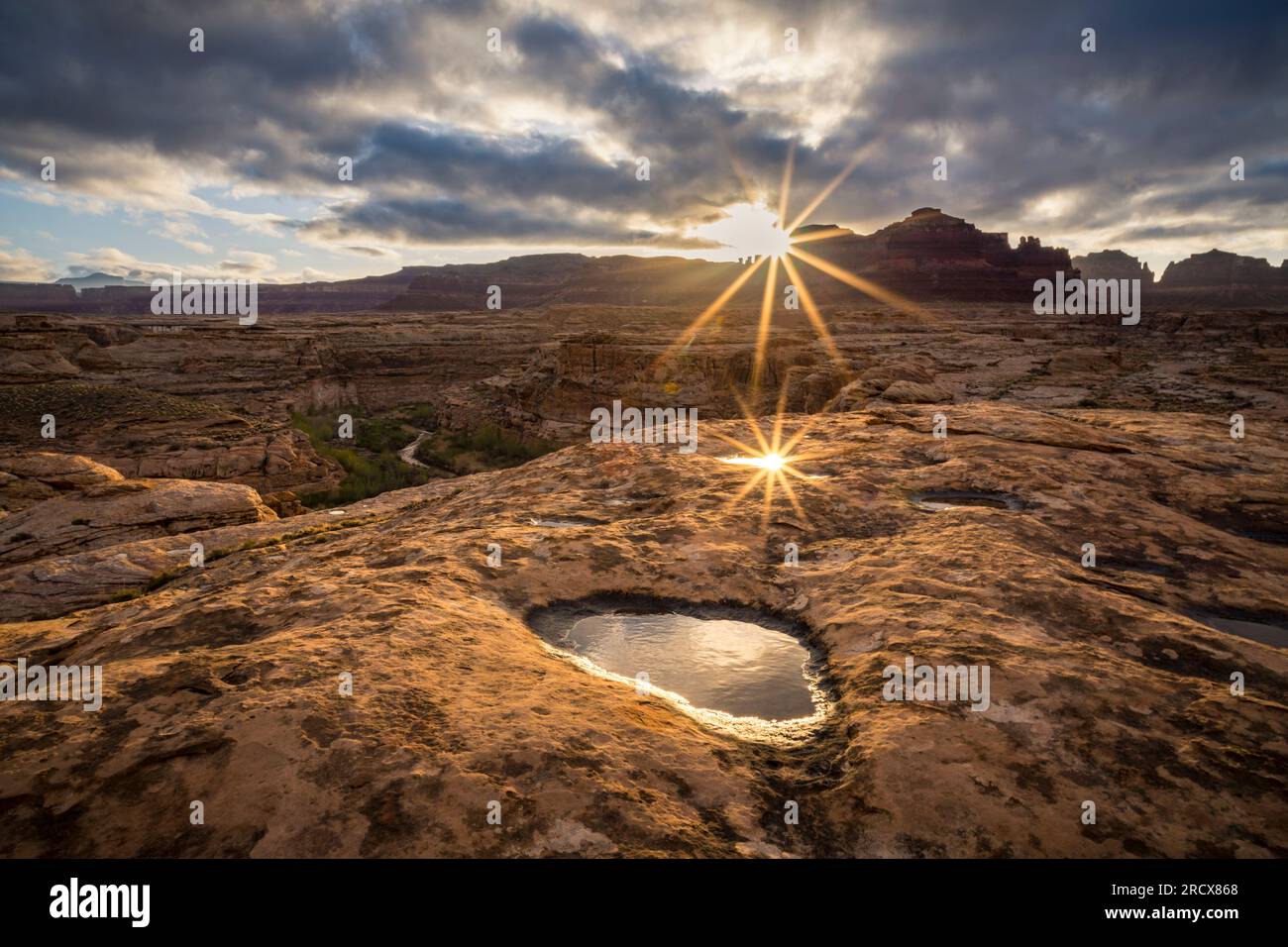 Sun rising in a desert landscape. Stock Photo