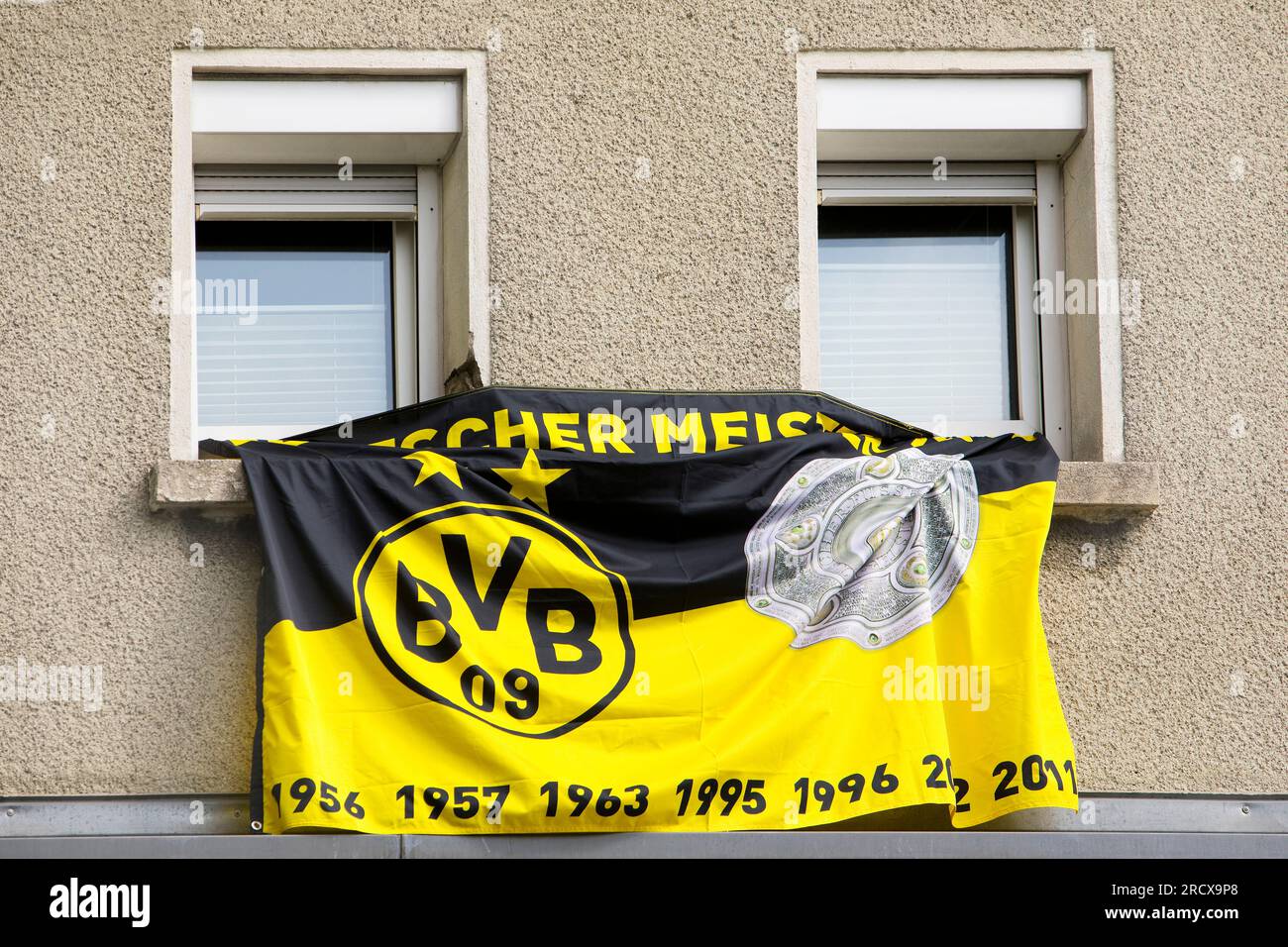 flags of Borussia Dortmund at a residential building, Germany, North Rhine-Westphalia, Ruhr Area, Dortmund Stock Photo